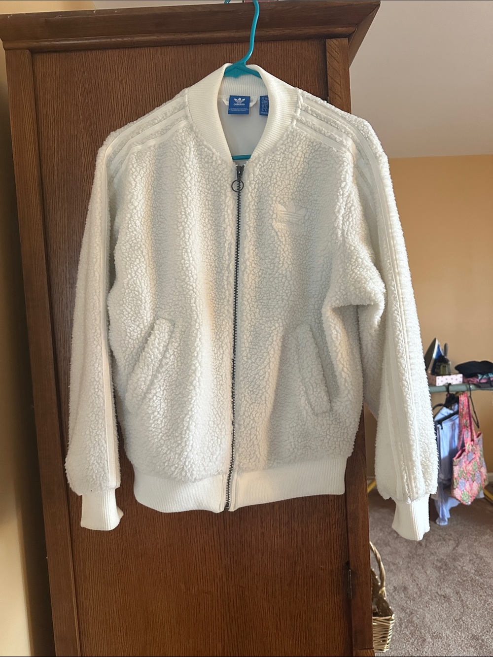 Adidas XS Sherpa waist jacket but looks oversized. Not tight fit at all